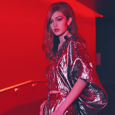 Woman In Red Sequined Top And Skirt GIF