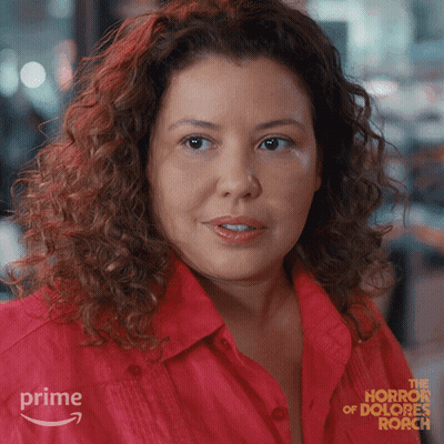 Woman In Red Shirt Advertising Horror Of Dolores Roach On Amazon Prime GIF