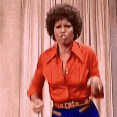 Woman In Red Shirt And Blue Jeans Dancing GIF