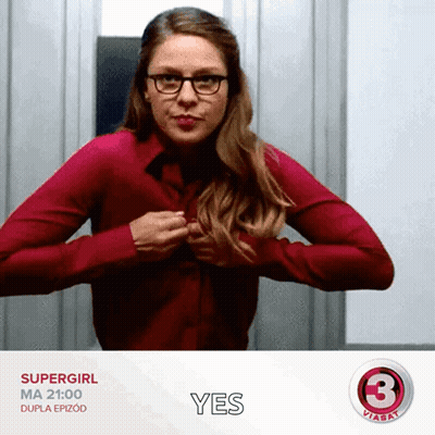 Woman In Red Shirt And Glasses Holding Chest Saying Yes GIF