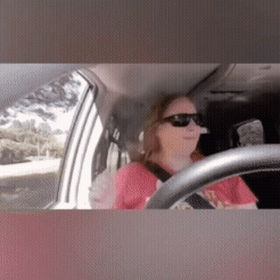 Woman In Red Shirt Driving Car With Sunglasses GIF
