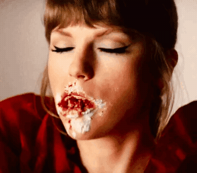 Woman In Red Shirt Eating Cake, Frosted Mouth GIF