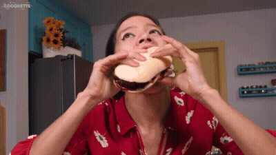 Woman In Red Shirt Eating Sandwich Coquette GIF