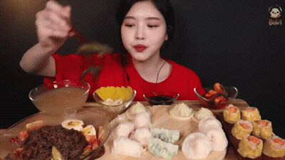 Woman In Red Shirt Eating With Chopsticks GIF