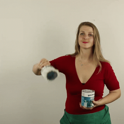 Woman In Red Shirt Holding Balsamo Kol GIF