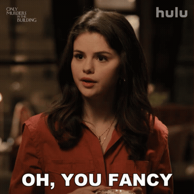 Woman In Red Shirt Holding Coffee Saying Oh You Fancy GIF