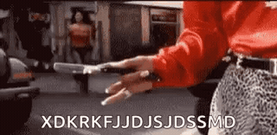 Woman In Red Shirt Holding Gun And Smoking GIF