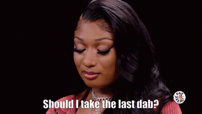Woman In Red Shirt Holding Hot Sauce Bottle GIF