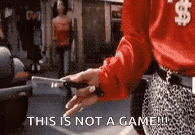 Woman In Red Shirt Holding Knife Saying This Is Not A Game GIF