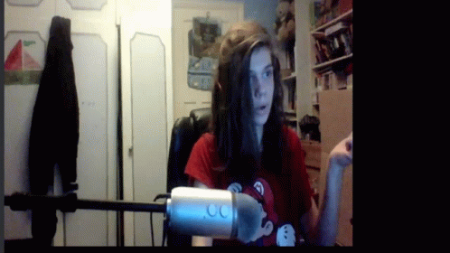 Woman In Red Shirt Holding Microphone GIF