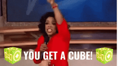 Woman In Red Shirt Holding Microphone Saying You Get A Cube GIF