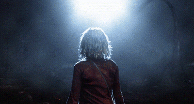 Woman In Red Shirt In Dark Room GIF