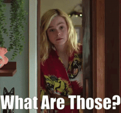 Woman In Red Shirt In Doorway Saying What Are Those GIF