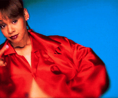 Woman In Red Shirt In Front Of Blue Wall GIF