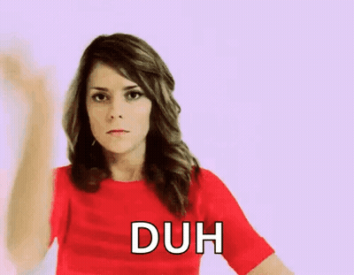 Woman In Red Shirt Making Duh Gesture GIF