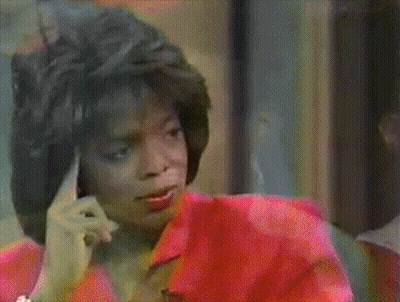 Woman In Red Shirt Making Finger Gesture GIF