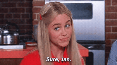 Woman In Red Shirt Making Funny Face GIF