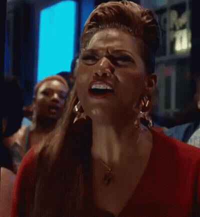 Woman In Red Shirt Making Funny Face GIF