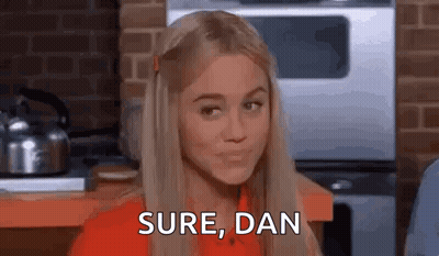 Woman In Red Shirt Making Funny Face GIF