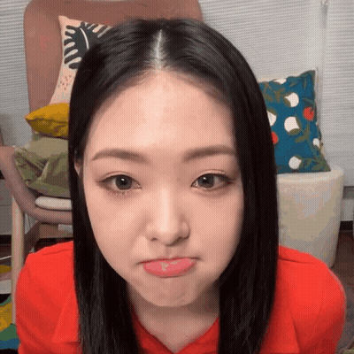 Woman In Red Shirt Making Funny Face GIF