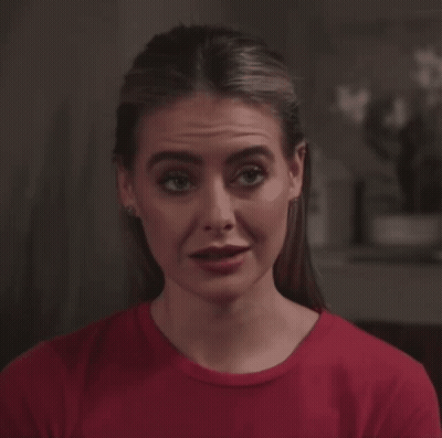 Woman In Red Shirt Making Silly Face GIF