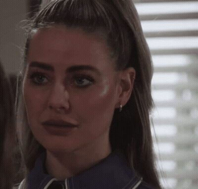 Woman In Red Shirt Making Silly Face GIF
