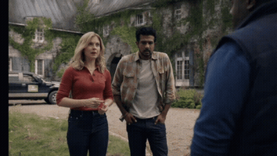 Woman In Red Shirt Next To Men In Plaid And Blue Vest GIF