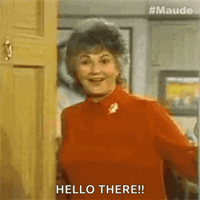 Woman In Red Shirt Saying Hello There GIF