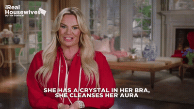 Woman In Red Shirt Says Crystal In Bra Cleanses Aura GIF