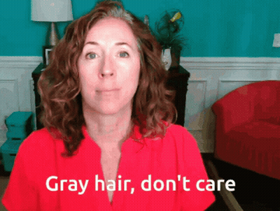 Woman In Red Shirt Says Gray Hair Don't Care GIF