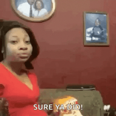 Woman In Red Shirt Sitting On Couch In Front Of Couple Picture GIF