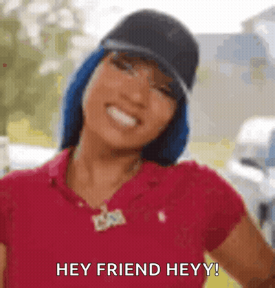 Woman In Red Shirt Smiling Saying Hey Friend GIF