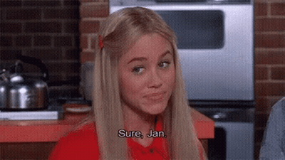 Woman In Red Shirt Talking In Kitchen GIF