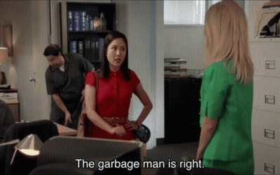 Woman In Red Shirt Talking To Woman In Green Suit Saying Garbage Man Is Right GIF