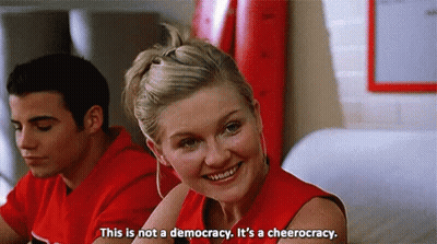 Woman In Red Shirt This Is Not A Democracy It's A Cheerleading GIF