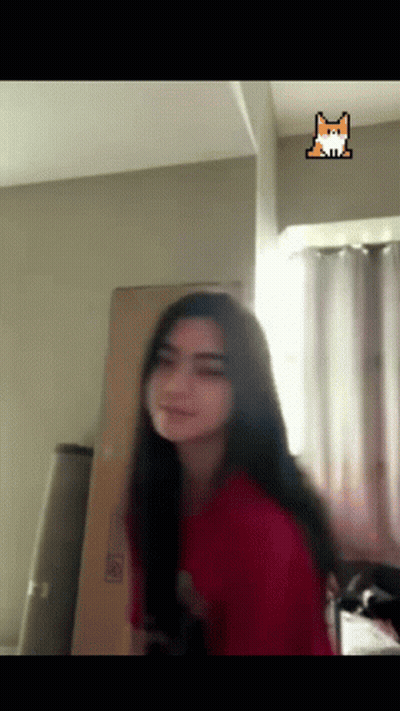 Woman In Red Shirt With Fox Sticker On Ceiling GIF