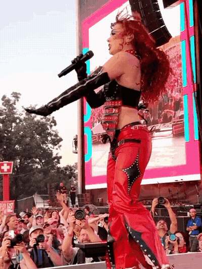 Woman In Red Singing Into Microphone GIF