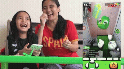 Woman In Red Span Shirt Laughing With Girl GIF