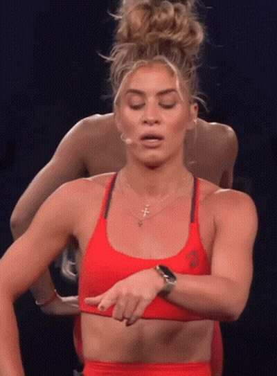 Woman In Red Sports Bra Pointing At Chest GIF