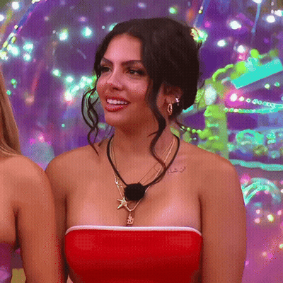 Woman In Red Strapless Top With Gold Starfish Necklace GIF