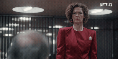 Woman In Red Suit At Netflix Sign GIF