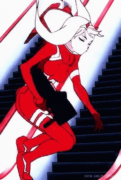 Woman In Red Suit Walking Down Stairs GIF
