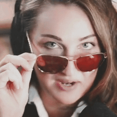 Woman In Red Sunglasses Making Face GIF