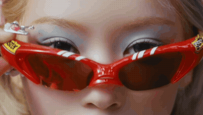 Woman in Red Sunglasses Saying Sticky