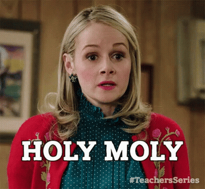 Woman In Red Sweater And Green Shirt Says Holy Moly GIF