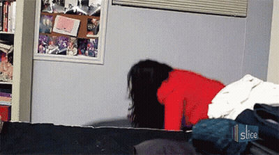 Woman In Red Sweater Laying On Bed With Slice Sticker GIF