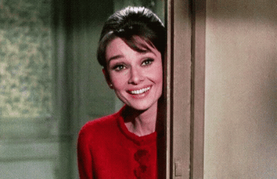 Woman In Red Sweater Peeking Out Of Doorway GIF