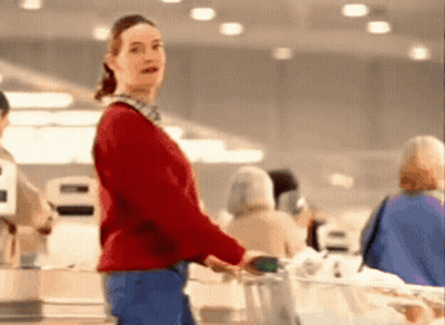 Woman In Red Sweater Pushing Grocery Cart GIF