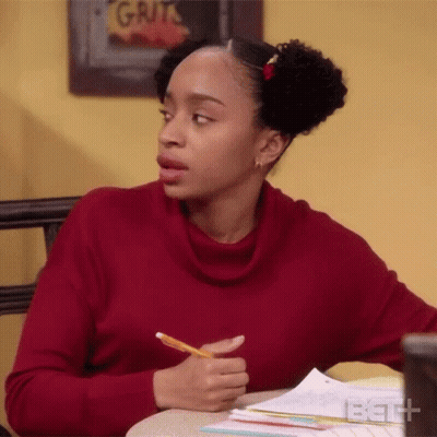Woman In Red Sweater Sitting At Desk With Pencil GIF