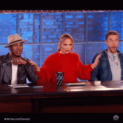 Woman In Red Sweater Sitting With Two Men GIF